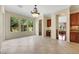 Bright, open kitchen space with desk, tile flooring, and backyard views at 2175 Sandstone Cliffs Dr, Henderson, NV 89044