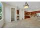 Spacious kitchen area with wooden cabinetry, stainless appliances, and walk-in pantry at 2175 Sandstone Cliffs Dr, Henderson, NV 89044