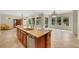 Kitchen with granite island, stainless steel appliances and ample space at 2175 Sandstone Cliffs Dr, Henderson, NV 89044