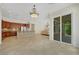 Open floor plan showcasing kitchen with granite countertops, stainless steel appliances, and stone breakfast bar at 2175 Sandstone Cliffs Dr, Henderson, NV 89044