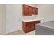 Functional laundry room with cabinetry, sink, and convenient access to an exterior door at 2175 Sandstone Cliffs Dr, Henderson, NV 89044