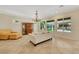 Bright living room with tile floors, elegant lighting, and ample seating at 2175 Sandstone Cliffs Dr, Henderson, NV 89044
