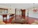 Spacious living room with hardwood floors, wet bar, and elegant decor at 2175 Sandstone Cliffs Dr, Henderson, NV 89044