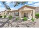 A covered patio and sliding glass door offering a seamless indoor-outdoor transition at 2323 Barbers Point Pl, Las Vegas, NV 89134
