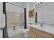 Bright bathroom with a tub and shower combination, vanity with mirror, and tile floors at 2323 Barbers Point Pl, Las Vegas, NV 89134