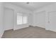 Bedroom features neutral carpet, a window with blinds, sliding door closet, and light walls at 2323 Barbers Point Pl, Las Vegas, NV 89134