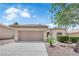 Well-maintained single-story home featuring a two-car garage and low-maintenance desert landscaping at 2323 Barbers Point Pl, Las Vegas, NV 89134