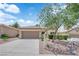 Charming single-story home with a two-car garage and meticulously xeriscaped front yard at 2323 Barbers Point Pl, Las Vegas, NV 89134