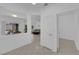 Hallway with an open concept to the dining and living area with neutral colors and tile floors at 2323 Barbers Point Pl, Las Vegas, NV 89134