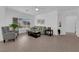 Bright living room with tile floors, comfortable seating, and neutral decor at 2323 Barbers Point Pl, Las Vegas, NV 89134