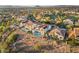 View of home with solar panels and private pool in community near golf course and desert landscape at 2736 Botticelli Dr, Henderson, NV 89052
