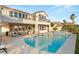 Stunning backyard oasis with a sparkling pool, a raised hot tub, and ample patio space for entertaining at 2736 Botticelli Dr, Henderson, NV 89052