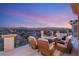 Inviting balcony with comfortable seating, offering panoramic views of the city and mountains at sunset at 2736 Botticelli Dr, Henderson, NV 89052