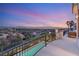 Spacious balcony view overlooking the neighborhood with mountain views in the distance at sunset at 2736 Botticelli Dr, Henderson, NV 89052