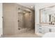 Contemporary bathroom featuring a glass-enclosed shower, vanity, and modern tile at 2736 Botticelli Dr, Henderson, NV 89052