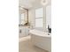 Stylish bathroom featuring a freestanding tub, modern fixtures, and ample natural light at 2736 Botticelli Dr, Henderson, NV 89052