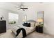 Cozy bedroom with a comfortable bed, stylish decor, and a ceiling fan at 2736 Botticelli Dr, Henderson, NV 89052