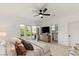 Spacious primary bedroom boasts natural light, a ceiling fan, and an ensuite bathroom at 2736 Botticelli Dr, Henderson, NV 89052