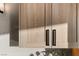 Close up of custom wood cabinetry with modern hardware in a well lit kitchen at 2736 Botticelli Dr, Henderson, NV 89052