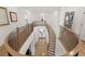 Beautiful upstairs hallway with wood floors, staircase, and modern chandelier at 2736 Botticelli Dr, Henderson, NV 89052
