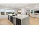Modern kitchen island featuring a breakfast bar and stainless appliances, with a great view at 2736 Botticelli Dr, Henderson, NV 89052