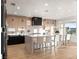 Bright and spacious kitchen with a large central island, counter seating, and stainless appliances at 2736 Botticelli Dr, Henderson, NV 89052