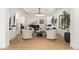Stylish living area featuring a grand piano, four armchairs, and modern lighting at 2736 Botticelli Dr, Henderson, NV 89052