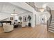 Elegant living room with hardwood floors, modern lighting, and grand piano at 2736 Botticelli Dr, Henderson, NV 89052