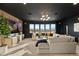 Large living room offers natural light, modern lighting, and stunning neighborhood views at 2736 Botticelli Dr, Henderson, NV 89052