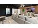 Modern living room features a large sectional sofa and a wall-mounted TV at 2736 Botticelli Dr, Henderson, NV 89052