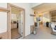 Spacious outdoor patio with a cozy seating area, an outdoor kitchen, and access to a convenient pool house bathroom at 2736 Botticelli Dr, Henderson, NV 89052