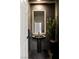 Modern powder room featuring dark tiling, a sleek vessel sink, and decorative lighting at 2736 Botticelli Dr, Henderson, NV 89052