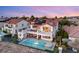 Beautiful two-story home with a pool, patio and rear balconies overlooking the backyard at 2736 Botticelli Dr, Henderson, NV 89052