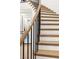 Staircase with light wood stairs, black metal railings, and ample natural light at 2736 Botticelli Dr, Henderson, NV 89052