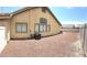 Backyard featuring low maintenance gravel, AC unit, and rear home exterior at 3125 Prairie Princess Ave, North Las Vegas, NV 89081