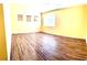 Bright bedroom features hardwood flooring and natural light from the windows at 3125 Prairie Princess Ave, North Las Vegas, NV 89081