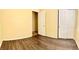 Bedroom with hardwood flooring, closet, and open door to the next room at 3125 Prairie Princess Ave, North Las Vegas, NV 89081