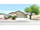 Charming single-story home featuring a three-car garage, desert landscaping, and a cozy, inviting facade at 3125 Prairie Princess Ave, North Las Vegas, NV 89081