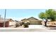 Charming single-story home featuring a three-car garage, desert landscaping, and a cozy, inviting facade at 3125 Prairie Princess Ave, North Las Vegas, NV 89081