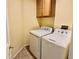 Laundry room featuring a washer and dryer with a cabinet above at 3125 Prairie Princess Ave, North Las Vegas, NV 89081