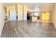 Bright living area with neutral walls, tile flooring, and seamless flow into the adjacent kitchen at 3125 Prairie Princess Ave, North Las Vegas, NV 89081