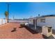 Large backyard features gravel landscaping, privacy fence and covered patio at 3212 Hickey Ave, North Las Vegas, NV 89030