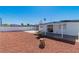 Large backyard features privacy fence, covered patio and easy care landscaping at 3212 Hickey Ave, North Las Vegas, NV 89030