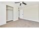 Bright bedroom features a ceiling fan, closet and neutral carpeting at 3212 Hickey Ave, North Las Vegas, NV 89030