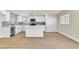 Modern kitchen with white cabinets, stainless steel appliances, and center island at 3212 Hickey Ave, North Las Vegas, NV 89030