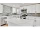 Stylish kitchen with marble countertops, island and stainless steel appliances at 3212 Hickey Ave, North Las Vegas, NV 89030