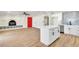 Open-concept living area with a fireplace, wood floors, and connected kitchen space at 3212 Hickey Ave, North Las Vegas, NV 89030