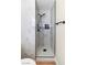 Updated shower features black hardware, white marble tile and glass surround at 3212 Hickey Ave, North Las Vegas, NV 89030