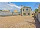 Large backyard with gravel landscaping and block wall providing privacy at 356 Gulfport Ct, Las Vegas, NV 89145