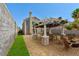 Outdoor living space features a pergola, seating area, fire pit, and a built-in grill at 356 Gulfport Ct, Las Vegas, NV 89145